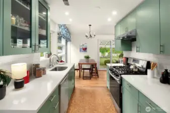 The gorgeous kitchen was updated in 2021 with new counters, cork floors, cabinets and stainless appliances.