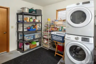The large utility room offers great storage and conveniently sits between the attached garage, kitchen, and with a door out to your gorgeous yard.