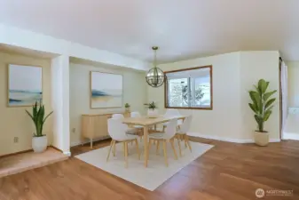 Nice dining area which is open to the living room and the kitchen (virtually staged)    Window looks out to the covered Trex deck and beautiful landscaped and fenced back yard.