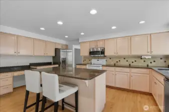 Generous sized kitchen lots of cabinets and counter space.