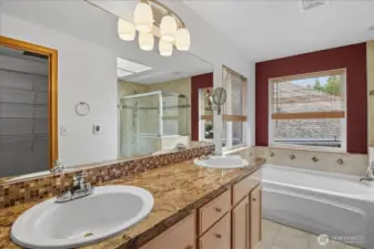 The primary en-suite has a double vanity and heated floors.