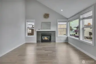 Living Room/Great room with GAS fireplace and water/city view from corner window