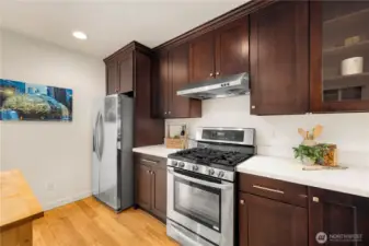 Plenty of storage in the kitchen and glass display doors closest to the breakfast bar.