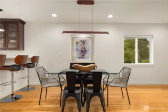 Separate dining area with new lighting and paint. Nook is perfect for bar/wine stemware and storage.