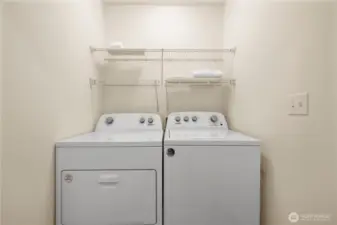 Full laundry area across from the powder room.