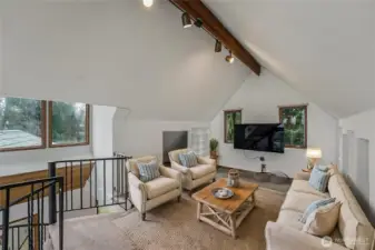 They virtually staged loft as a bonus living room.