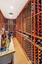 Custom wine cellar with extensive wood racking offers impressive storage for a curated collection—ideal for entertaining and wine enthusiasts alike.