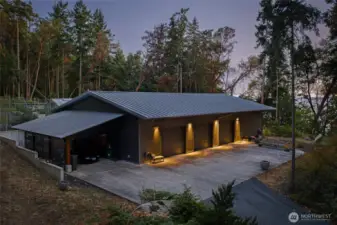 Expansive detached workshop and multi-bay garage provide exceptional space for vehicles, equipment, and creative projects—an ideal complement to this luxury San Juan Island estate.