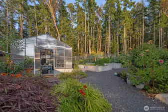 A fully equipped greenhouse and productive garden space allow for year-round growing, complementing the estate’s self-sufficient island lifestyle on San Juan Island’s coveted west side.