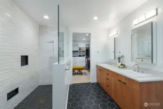 Primary bath with gorgeous porcelain tile and amazing closet