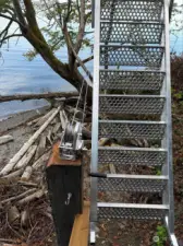 Sturdy metal stairs to the private beach