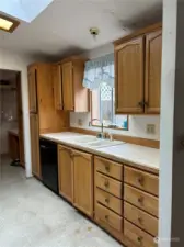 Kitchen. The marks on the ceiling are from the time the skylight leaked. It has been replaced and no longer leaks.