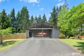 The long flat driveway and carport fronts to the Killdeer cul-de-sac for easy access and ample guest parking.