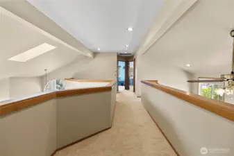 Enjoy the large Catwalk upstairs separating the primary bedroom from the 2 other bedrooms.  Gives the primary bedroom extra privacy.  Look at the lovely tall ceilings!