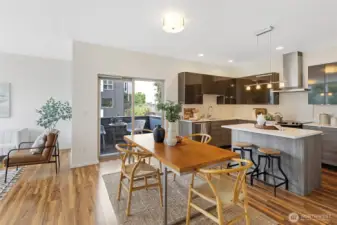 The second level is the heart of the home, with the kitchen, dining, living room, covered deck, and convenient ½ bath.