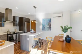 From here you can see the kitchen’s walk-in pantry, tucked just to the right of the fridge—perfect for storing all your favorite ingredients and snacks.