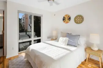 One flight up is the first bedroom—perfect as a guest suite, home office, or peaceful retreat.