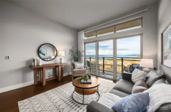The same bright, open living room, this time highlighting the expansive windows that frame stunning views beyond, filling the space with light and creating a seamless connection between indoors and out.