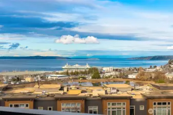 Expansive views stretch across the Port of Edmonds and Puget Sound, with ferries gliding by, boats coming and going and the water reflecting the light throughout the day.