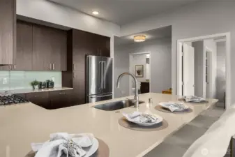 A spacious kitchen bar ideal for entertaining, with plenty of seating for guests, room for drinks and appetizers, and a perfect spot to gather while cooking or enjoying the view.