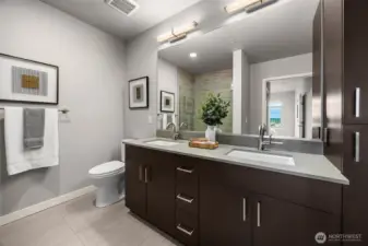 An elegant ensuite bath featuring a spacious double vanity with ample storage and a luxurious, spa-like feel.
