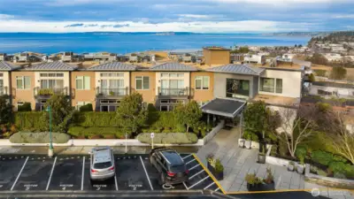 Aerial view highlighting the main entrance of 50 Pine, showing the approach, landscaping, and welcoming entryway from above.