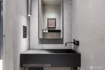 Entry hall powder room with custom steel sink, faucet and details.