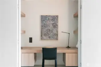 Convenient home office and storage tucked away behind hidden doors.