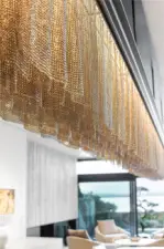 Custom stainless steel chain mail dinning room light fixture.