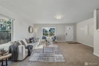 Step into a warm, welcoming main level with fresh interior paint and wide open living space. The layout offers flexibility, comfort, and charm, with easy access to the upstairs, kitchen, and outdoor areas.