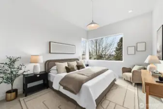 Primary suite with tall ceilings, walk-in closet, and spa-like bath.