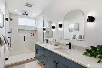 Well-appointed primary suite with dual sinks, rainfall shower, & heated floors.