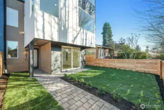 Fenced yard off the entry and family/rec room.