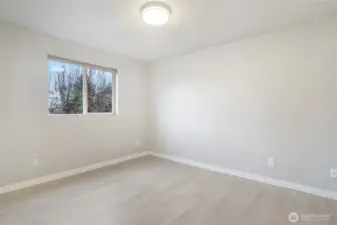 Bedroom 1 with views of front street