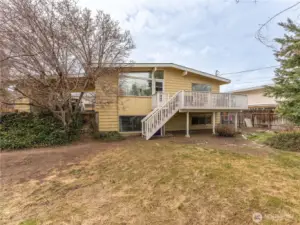 Exterior perspective showing mid-century ranch architecture.