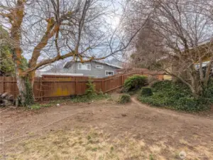 Spacious fully fenced backyard with irrigation and room to garden.