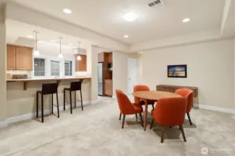Open-concept kitchen and dining area with eating bar, creating an easy flow for everyday living and entertaining, complemented by skylights that bring in natural light.
