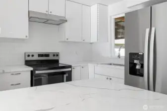 New stainless appliances, quartz counter tops and sleek cabinets.