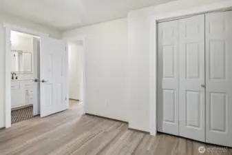Primary suite has it's own entrance to the shared bathroom and easy maintenance flooring.
