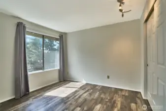 Large window is a nice accent in the first bedroom.
