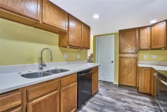 Kitchen shows plenty of cabinet space.