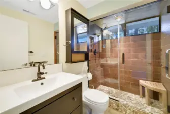 Primary 3/4 bath w/river rock shower