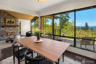 The formal dining space is perfectly positioned between the living room and the kitchen. Whether you choose the living room, formal dining room, kitchen bar or casual dining space - all on the upper level - you have incredible views to sooth the senses while enjoying a meal.