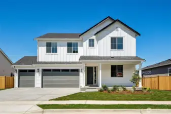 Actual home: farmhouse elevation, 3-car garage