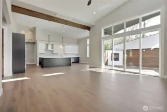 Large Sliding Door provides access to covered back porch equipped with gas fireplace.
