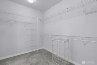Spacious walk-in closet has room for all your things.