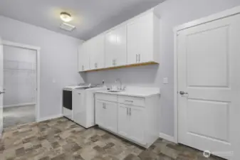 The utility room is conveniently located right off the primary closet.