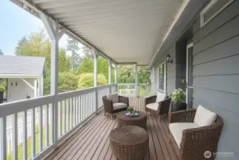 Enjoy a front porch that offers access to the fenced yard at each end. Plenty of room for entertaining.