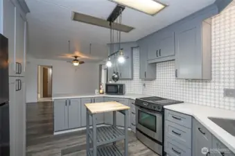 From the kitchen, take in the dining area’s open layout.