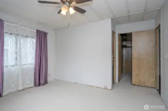 Another view of the primary suite, with the walk-in closet located just behind the entry door.